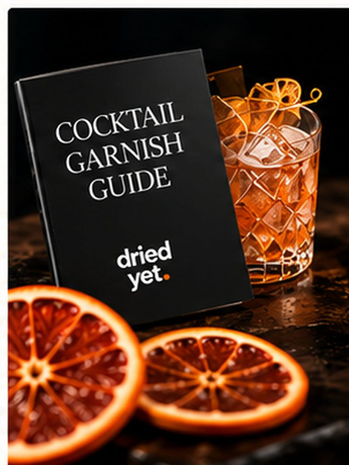 Dried Yet. Cocktail Garnish Guide booklet beside dried orange slices